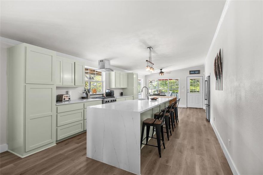 Tucked away in the peaceful White Oak Creek Ranch subdivision, this fully renovated 3-bedroom, 2-bath home sits on 3.1 acres overlooking the serene waters of Lake Renshaw. With modern updates throughout—including a stunning waterfall island kitchen with Viking stove and beautifully refreshed bathrooms—this property blends comfort and style with the feeling of seclusion and exclusivity. Two screened-in porches and a wraparound porch create the perfect vantage points for enjoying the natural setting, while a spacious six-car carport adds practicality. Whether you’re kayaking on Lake Renshaw, casting a line for afternoon fishing, or simply savoring the quiet views, this retreat offers a rare opportunity to enjoy country living with modern touches.