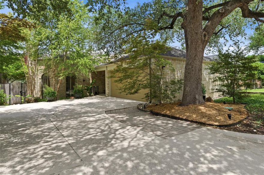 This dramatically sleek contemporary zero lot home will captivate you from the moment you enter.  Beautifully landscaped patios, visible from most rooms, beckon you outside.  A cathedral beamed ceiling and brick fireplace accent the spacious living room that opens to the dining room with double doors opening to the side patio.  A generous space extends from the dining area that offers room for appetizers when company comes.  A skylight illuminates the kitchen with its granite counters, a farm sink, double ovens, and refrigerated wine cooler.  The breakfast room opens to a courtyard that provides easy access for a grill chef.  Oversized tile flooring flows continuously throughout the home.  The primary bedroom, with its high ceiling, offers a door to the backyard pool.  A large shower, a copper soaking tub, separate vanities, walk-in closets, and a private toilet are amenities to appreciate.  The secondary bedroom offers courtyard views and a full bath.  A private office is adjacent to the foyer.  The garage is quite large and has plenty of storage space, as well as a laundry room with built-in cabinets.  All furniture is negotiable. Enjoy being convenient to downtown Dallas or northern suburbs,