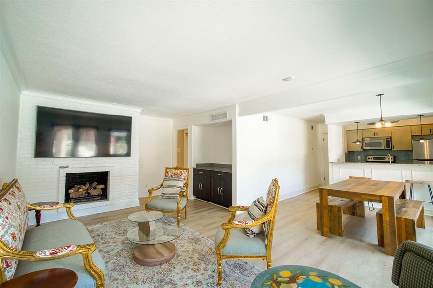 Experience low-maintenance living in this updated FIRST-FLOOR condo located in the GATED community of The Tuscany, ideally situated near SMU, Greenville Avenue, Mockingbird Station, Central Market and Tom Thumb. What truly sets this unit apart from others in the community is its highly desirable location within the complex. Easy guest access directly from the nearby pedestrian gate, covered parking spots (#73 & #74) conveniently located just outside your private patio gate, and close proximity to the fitness center located in the white building across from your parking spaces. Enjoy access to the cabana just steps from the front door - offering a rare “second outdoor living space” perfect for relaxing or gathering with friends. The open layout is bright featuring updated flooring, a fireplace, and a well-appointed kitchen with granite countertops, stainless appliances, and tile backsplash. The primary suite and secondary bedroom offer flexibility for guests or a home office. Steps from University Crossing-Ridgewood Trails, and the SMU Shuttle runs down Sandhurst in front of the community. Updates include fridge and custom window treatments (2022), guest bathroom vanity, vinyl plank flooring, turf in yard, kitchen cabinets, backsplash and countertops (2023), and AC (2024). Ask to see the 3D tour!