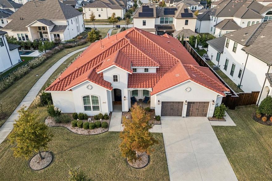 This stunning home showcases an elegant blend of modern sophistication & timeless design, thoughtfully crafted for both everyday living and entertaining. Rich architectural details set the tone throughout, including vaulted ceilings accented by wood beams, designer lighting, & sliders that flood the space w-natural light. The open-concept living area is anchored by a striking fireplace w-custom tile surround & flows seamlessly into the gourmet kitchen. Designed to impress, the kitchen features an oversized quartz island w-seating, custom cabinetry, ss appliances, dbl ovens, & eye-catching designer backsplash. The dedicated media rm is a true standout featuring wet bar & built-ins. Neutral tones, wide-plank flooring, & upscale finishes throughout create a cohesive, move-in-ready experience. Primary Suite offering tranquil views of the backyard & spa-inspired en suite bath elevates everyday living with a freestanding soaking tub, walk-in shower w-frameless glass w-built-in bench, & dual vanities w-sleek quartz countertops & modern fixtures. A dedicated beverage station w-cabinetry & mini fridge adds a thoughtful luxury touch, perfect for morning coffee or evening wind-downs. Office w-built-ins. Flex space perfect for exercise, 2nd office, hobby or play rm. 3 car garage. Indoor & outdoor living connect effortlessly, enhancing the home’s functionality & lifestyle appeal. This backyard is a true private oasis, at the center is a sleek, resort-style pool w-clean lines & elegant tile detailing. Covered patio w-motorized screen-perfect for enjoying the space year-round. Outdoor kitchen & dining area elevates the experience with a built-in grill, comfortable seating, & cozy fire pit area creating an inviting spot for evening conversations while modern privacy fencing & mature landscaping provide both beauty & seclusion. Seamlessly blending luxury & functionality, this yard offers a resort-like setting ideal for entertaining & enjoying outdoor living at its finest. Must See!