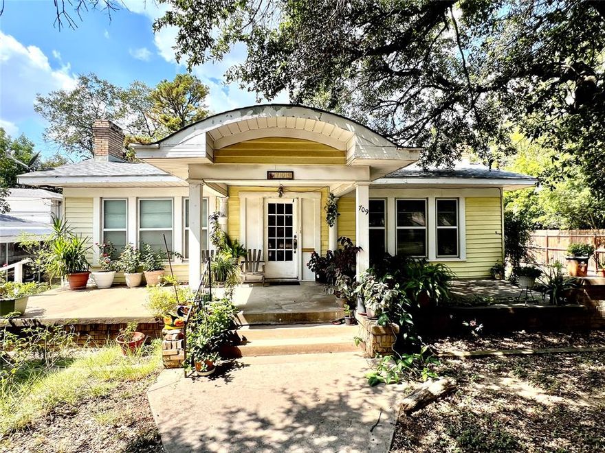 This 1930s-built charmer on Seaman St is just oozing with character! Just look at the beautiful wood floors and built in bookshelves and cabinets! This 2046 sq ft home features 3 bedrooms and two bathrooms, with a bonus sleeping porch, breakfast nook, formal dining area and a spacious living room! The kitchen has ample cabinets and counter space, and adjoins the breakfast nook, which has built-in china cabinets. The front of the house features a carport, circle drive, and a lovely covered front porch. Out back you'll find a large screened-in porch area, a fenced dog run and portable storage buildings and several large shade trees. Come take at this beauty!
