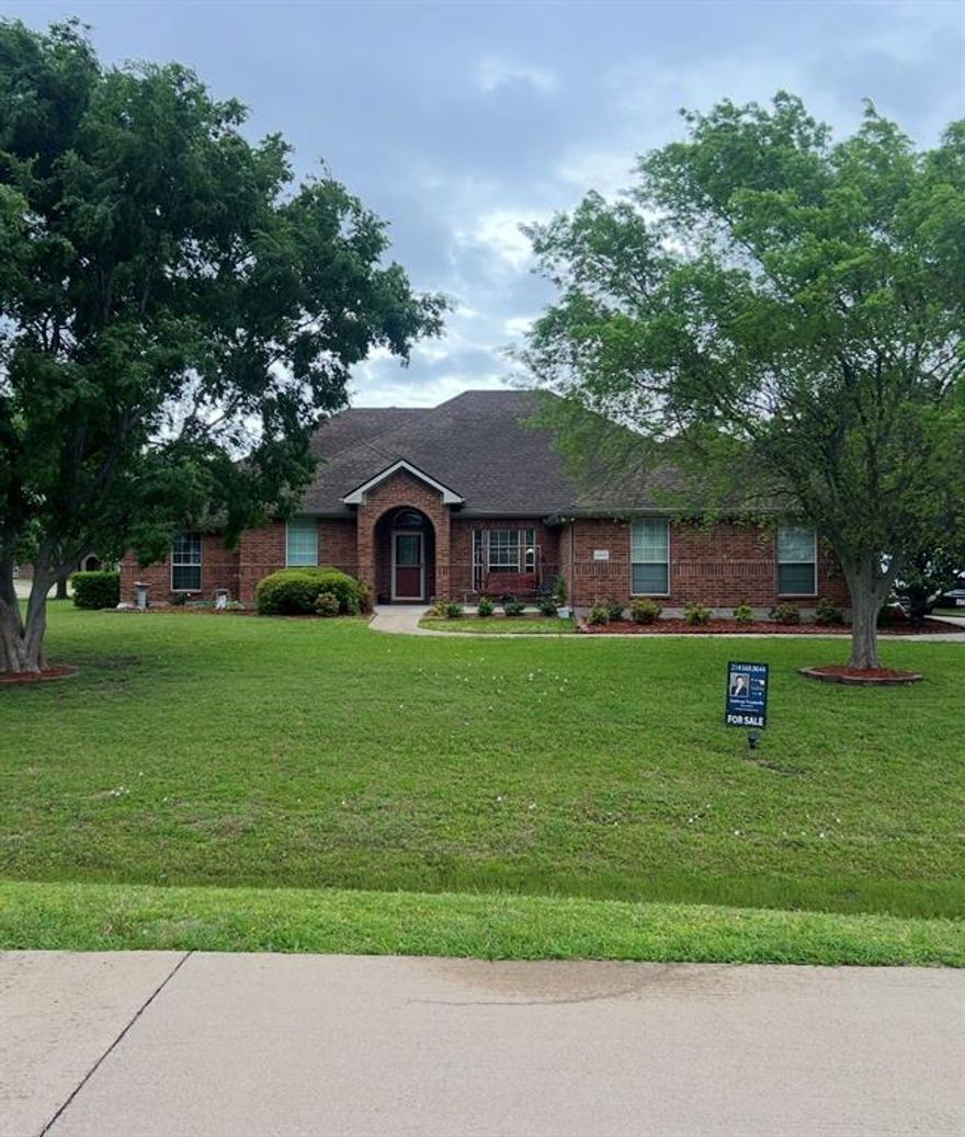 Country living just minutes away from Wide Awake Wylie and Lake Lavon! Situated on a spacious 1.5-acre corner lot, this stunning single-story ranch style blends comfort, flexibility, and function. New carpet installed throughout. Two generous living areas and a large game room provide ample space for entertaining. The front office can easily convert to a bedroom taking it from a 3 to 4 bedroom, while the game room and second full bath offer ideal potential for a private mother-in-law suite.The beautiful kitchen is a chef’s delight, featuring double ovens and abundant prep space. The expansive primary suite includes a spa-inspired ensuite bath and two oversized walk-in closets for ultimate convenience. Step outside to a 695 sqft covered back patio perfect for year-round outdoor living. A standout feature is the impressive 1,500-square-foot shop built on a concrete foundation with sheet rock walls, electricity, water, a half bath, a 6ft x 50ft covered porch and large roll up doors for easy access—ideal for projects, hobbies, a business or extra storage. This exceptional property offers space, versatility, and an unbeatable location. Buyer to verify measurements.