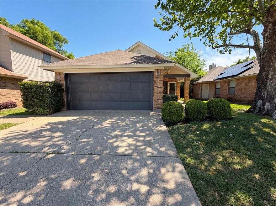 Imagine 8505 Tallahassee Ln, a recently improved residence featuring a functional fireplace. The kitchen contains all stainless steel appliances and an accent backsplash. The primary bathroom provides double sinks. Outside, a covered patio extends to a fenced in backyard. The property has fresh interior paint, fresh exterior paint, and a partial flooring replacement throughout. This residence presents a refreshed and practical living environment. This home has been virtually staged to illustrate its potential.. Home comes with a 100-Day Home Warranty and a 7-Day Home Test Drive to move in 7 days early for free