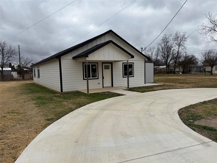 No wasted space in this little jewel! Put this one on the top of your list, as it is sure to check all the boxes!  Spacious open floor plan with large kitchen that includes a refrigerator, electric range, microwave and dishwasher. Built in 2023, you'll find lots of windows throughout this move in ready 3 bedroom 2 bath home with luxury vinyl plank flooring. Laundry room includes a stackable washer*dryer. All bedrooms have walk in closets. Primary bath vanity has dual sinks. Concrete circular drive in the front and a covered side patio off of the utility room. Large side and back yard grassed areas.