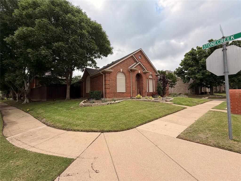 Photo of 8640 Woodcreek Drive, Irving, TX 75063 (MLS # 21252106)