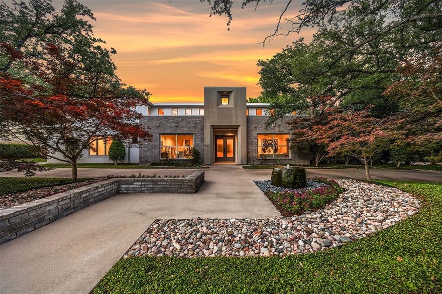 Perfectly positioned on the 16th hole of Bent Tree Country Club, this exceptional custom home offers over 7,100 square feet of luxury living on a 0.379-acre golf course lot. A circle drive, mature trees, lush landscaping, and two water features create a striking first impression, while the interior showcases thoughtful design, refined finishes, and modern functionality. The expansive layout includes five living areas, four bedrooms with en suite baths and custom walk-in closets, and three additional half baths. The gourmet kitchen is a chef’s dream with Sub-Zero refrigerator freezers, Thermador gas range with grill, griddle, and double ovens, double Thermador dishwashers, a Miele built-in coffee system, oversized island, custom cabinets, walk-in pantry, and built-in desk. Entertaining is effortless with three wet bars, a 700-bottle climate-controlled wine room, media room with built-in speakers, and multiple gathering spaces. The luxurious primary suite features a gas fireplace, spa-inspired bathroom with dual vanities, frameless shower, SOK soaking tub, smart bidet, and a boutique-style closet with built-in Viking safe and ironing board. A private laundry room and coffee bar with beverage fridge offer added convenience. Hunter Douglas automatic window treatments are found throughout the home. Enjoy panoramic golf course views from the backyard oasis with a sparkling pool, spa, covered patio, and a gourmet outdoor kitchen. Additional highlights include a metal roof with gutters and leaf guards, Lutron lighting, smart home systems including Nest and iAquaLink, Flo by Moen water shutoff, two tankless water heaters, updated HVAC units, fire suppression system, and a spacious three-car garage with built-ins.