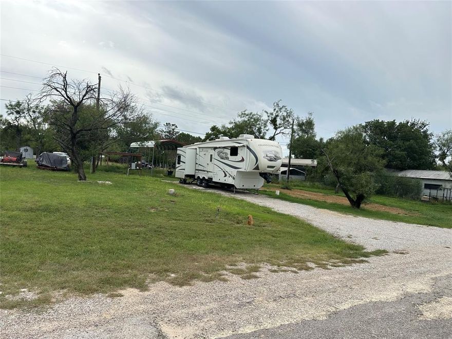 Three great lots in Promontory Park on Proctor Lake with electricity, septic, a few mesquite trees. These lots include a 2011 Grand Junction RV.