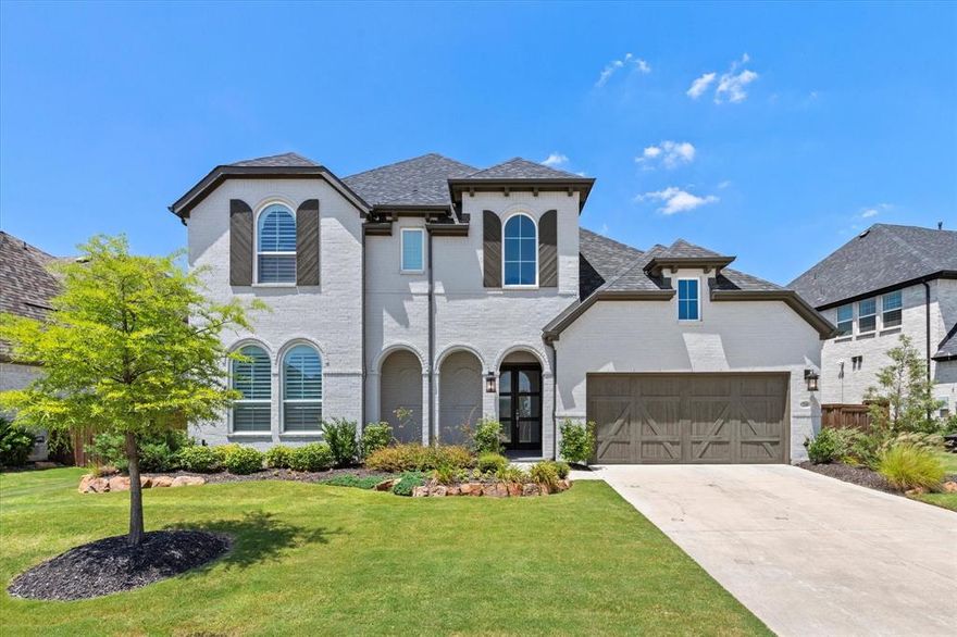 Luxury living in the award-winning Star Trail community—this stunning Highland home offers soaring ceilings, a first-floor media room, and a highly desirable multigenerational floor plan in the heart of Prosper. Perfectly positioned in one of North Texas’ most sought-after suburbs and zoned to top-rated Prosper ISD, this exceptional residence blends upscale design with the comfort and flexibility today’s buyers are searching for. Step inside to discover dramatic 21-foot ceilings, extensive hardwood flooring, and a bright open-concept layout designed for modern living and effortless entertaining. The chef-inspired kitchen features quartz countertops, Frigidaire Professional stainless appliances, a five-burner gas cooktop, double ovens, under-cabinet lighting, and a spacious walk-in pantry—all opening seamlessly to the expansive living and dining areas. A wall of windows fills the space with natural light while the elegant gas fireplace creates a warm and inviting focal point. The thoughtfully designed multigenerational floor plan offers multiple bedrooms on the first floor, each with private ensuite baths and walk-in closets. The luxurious primary suite provides a peaceful retreat with a spa-inspired bath and oversized walk-in closet with convenient access to the laundry room. Enjoy cinema-style movie nights in the dedicated first-floor media room, while the upstairs game room offers additional space for entertaining, gaming, or relaxing with family and friends.
Step outside to your covered patio with a cozy fireplace—perfect for enjoying Texas outdoor living year-round. Star Trail residents enjoy resort-style pools, clubhouses, tennis and pickleball courts, parks, and miles of scenic walking and biking trails. Conveniently located near the Dallas North Tollway with easy access to Frisco shopping, dining, and the PGA District, this home offers the perfect combination of luxury, lifestyle, and location in Prosper. Going Live March 16th