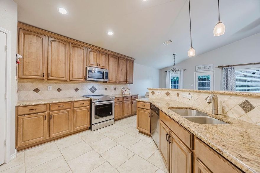 Discover your dream home at 5317 Comanche Wells Dr in McKinney! This beautifully maintained 3-bedroom, 2-bathroom residence features an impressive open floor plan, enhanced by soaring high ceilings that amplify the sense of space. The heart of the home is the custom kitchen, showcasing exquisite granite countertops and ample storage. Step outside to a private backyard oasis, fully enclosed by a quality cedar fence and a pergola, ideal for entertaining or quiet relaxation. Experience comfort and style in this highly sought-after McKinney community across from Adriatica Village. Community features a park and splash pad.