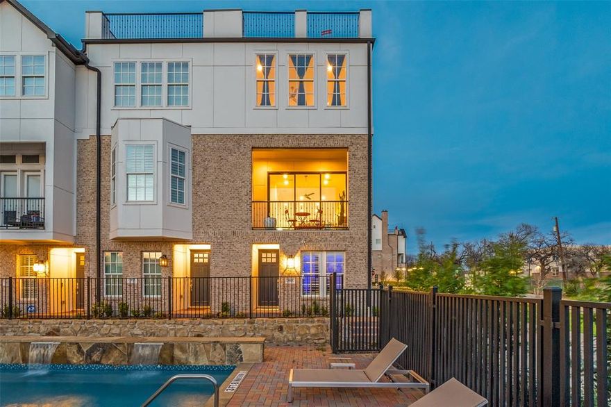 Welcome to this exceptional 3-story townhome situated near the Medical District & Oak Lawn. Perfectly blending modern luxury with thoughtful design, this corner-unit residence offers unparalleled views, premium finishes, & a low-maintenance lifestyle ideal for those who appreciate style and convenience. With soaring ceilings and abundant natural light, the spacious main living areas boast elegant white oak flooring that flows seamlessly throughout. This home is an entertainer’s dream, with a contemporary kitchen featuring custom cabinetry, luxurious marble countertops, and a stunning designer tile backsplash. Bosch appliances, including a gas cooktop, wall oven, and built-in microwave, make both cooking and entertaining a breeze. The thoughtful layout includes a covered second-floor balcony and an expansive rooftop deck – both offering sweeping views of the iconic Dallas skyline, perfect for enjoying sunsets or entertaining guests. These outdoor spaces overlook the community's sparkling pool, providing a serene backdrop to your daily life. Each of the home’s three bedrooms offers an ensuite bath, ensuring privacy and convenience. The primary suite is a true retreat, offering a spa-like bathroom with an oversized garden tub, a luxurious walk-in shower, dual vanities, & a walk-in closet that provides ample storage space for even the most extensive wardrobe. Plush carpet in the bedroom quarters offers added comfort. Not only is this townhome beautifully designed, but it’s also ideally situated for urban living. Located near Oak Lawn, downtown Dallas, & Love Field, this property offers quick access to major transportation routes, including DART, Dallas North Tollway, & I-35, putting the entire city at your fingertips. Whether you’re looking to enjoy the vibrant local culture, stroll through nearby parks, or commute with ease, this townhome offers a rare combination of high-end features and an unbeatable location.