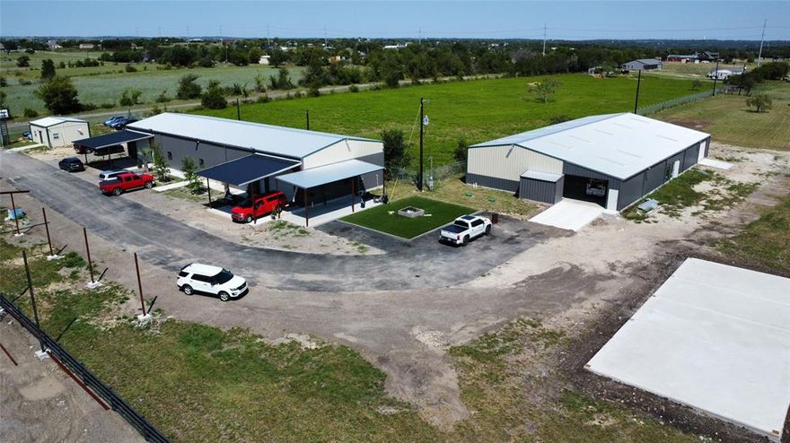 7 Acres Approximately 27,500 SF Warehouse Space. No Zoning. Rare opportunity to acquire a fully fenced and gated 7-acre industrial site in unincorporated Weatherford near Azle, offering approximately 27,500 square feet of warehouse space across multiple buildings. Located outside city limits with no zoning restrictions, this property provides maximum flexibility for owner-operators, investors, or developers. The site includes One 10,000 SF climate-controlled flex building, currently used as Automotive Sales. A 9,750 sqft metal warehouse, spray foam insulation, concrete slabs, overhead doors. One newly completed 7,800 sqft warehouse expansion or outdoor storage revenue Tenants (or future occupants) may add utilities and custom improvements, including electric, office build-outs, air conditioning, restrooms, fencing, water wells, and septic, subject to need and budget. The property is fully enclosed with perimeter fencing and an electric access gate. Outdoor equipment storage lots ranging from .25 acre to 1 acre can be separately leased or repurposed, with strong demand from trades, logistics, fabrication, landscaping, or heavy equipment operators. This site is ideal for owner-use, income generation, or development. No zoning. No city entitlements. High-demand contractor market.