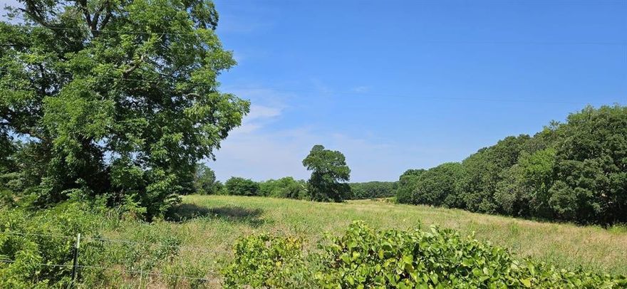Discover a rare investment opportunity just outside the Denison city limits. This expansive 17.5 acre parcel offers gently rolling hills, a large pond, and abundant wildlife set against stunning countryside views. Zoned agricultural exempt and improved with a barn and robust barbed-wire fencing, this property is ideal for horses, cattle, grazing, or development. Accessible via a paved county road and served by aerobic septic systems, the land is conveniently located near Lake Texoma and Choctaw Casino, fusing rural tranquility with recreational access. Utilities are off-grid, and there are no HOA fees or restrictive covenants, with electric and water line easements in place. Situated in the Denison ISD, this property offers excellent flexibility for future residential or recreational development. Development potential for 35 .5 acre lots and 17 1 acre lots.  Secure your country retreat or investment today!