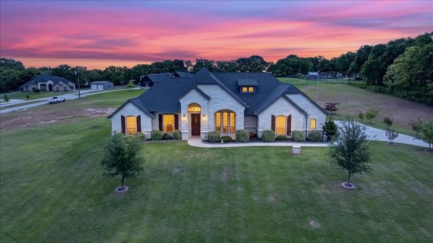 Welcome to 455 Christian Way, where thoughtful design, quality construction, and peaceful country living come together on 2.57 private acres. Tucked into a quiet neighborhood with a picturesque creek setting the tone at the front, this property offers the rare combination of privacy, functionality, and elevated finishes—with no HOA and a favorable tax rate. From the moment you arrive, as you wind your way to the home on the private driveway that has been chip sealed for durability, the curb appeal stands out with professionally enhanced landscaping and a bordered front sidewalk with a stone and brick elevation. Inside, the home opens to a spacious and inviting layout anchored by a stunning great room with soaring ceilings, exposed wood beams, and a floor-to-ceiling stone fireplace. Wood-look tile flooring carries throughout the main living areas, offering both style and durability. The kitchen is equally impressive, featuring an oversized island, granite countertops, custom cabinetry, decorative backsplash, and a statement vent hood that adds warmth and character. Every detail has been carefully considered to balance beauty and functionality. The primary suite serves as a true retreat, with a spa-like bath that includes a soaking tub, oversized shower with designer tile, dual vanities, and generous space to unwind. The office sits at the front of the home with expansive views of the front yard and offers french doors for privacy. The secondary bedrooms are split from the owner's retreat and all have spacious closets and boast ceiling fans. The custom tile in the bathrooms and laundry are GORGEOUS. Step outside and experience one of the property’s most impressive features—an expansive outdoor living area designed for year-round enjoyment. The covered patio with a second fireplace creates the perfect setting for gatherings or quiet evenings. The garage is fully insulated and features an epoxy-coated floor for a clean, finished look. Please see full list of upgrades!