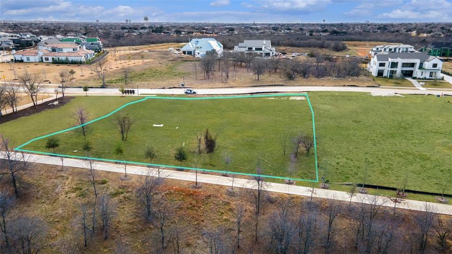 An exceptional opportunity to build your custom luxury estate on one of the best unimproved lots available in the prestigious, guard-gated Hills of Kingswood community. Situated on a generous .79-acre lot, this homesite stands out for its wider footprint, offering greater design flexibility and a more expansive feel than many surrounding properties.

Adding to its exclusivity, the lot features an easement along one side, meaning only one immediate neighbor—a rare and highly desirable advantage that enhances privacy and openness. This unique layout creates the ideal canvas for a thoughtfully designed custom home with ample outdoor living, courtyard potential, or a resort-style backyard.

Residents enjoy 24-7 guarded security, private hike and bike trails, and a setting synonymous with luxury living—all while being centrally located in the heart of Frisco near premier dining, shopping, and top-rated schools.

Bring your own builder and bring your vision to life. Opportunities like this—a wider lot, added privacy, and prime location within a coveted community—are truly rare. Don’t miss your chance to secure one of the finest remaining homesites in Hills of Kingswood.