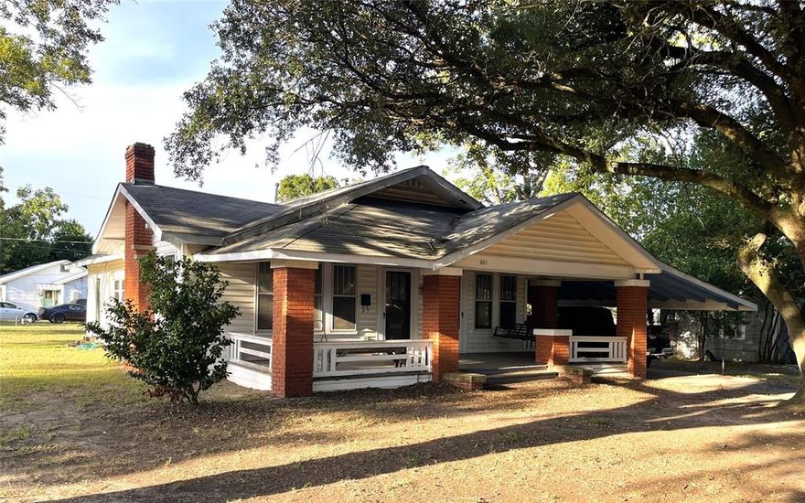 The charm of yesterday, modernized for life today!  New wiring & meter box, hardwired LED lighting, New plumbing with PEX, City of Teague recently replaced the gas line, Central heat & air, Gas for heat & water heater, vinyl siding, composition roof.  Original windows were saved & storm windows added for energy efficiency while maintaing the classic look of the home.  Kitchen & Both Bathrooms completely remodeled, wood flooring in many of the rooms with Tile in the kitchen & baths,  Primary Bdrm with ensuite bath, Cultured Marble Shower, shower seat, walk in closet,  Hall bath with tub & shower combo, Living room is open to the dining room with a fabulous galley kitchen, Custom Cabinets, Granite Counter Tops, Gas Stove, wired for under cabinet lighting, Huge utility room with exterior door to the backyard, storage bldg on slab with electricity, Big Shaded Curbed Corner Lot with Pecan & Oak trees, Covered front porch with carport on side of home. Not quite move in ready, but all of the major renovation has been completed.  Just a couple of blocks to the city park & rodeo arena.  Teague is approximately 95 miles S of Dallas & 60 miles E of Waco.