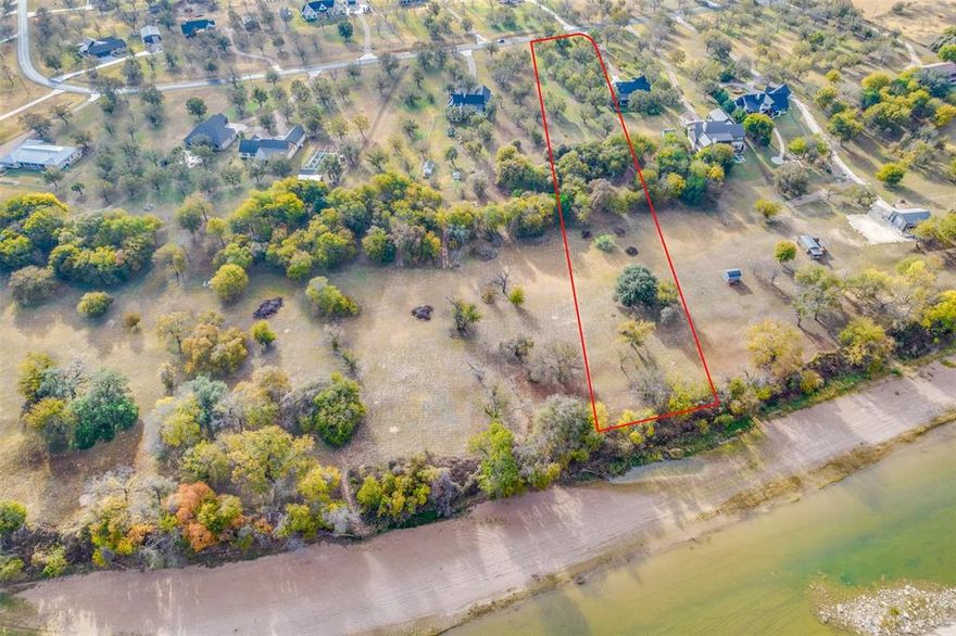 Build your dream home on one of the last available plots in The Orchards on the Brazos. This 2.2-acre riverfront lot offers private access to the Brazos River, surrounded by mature pecan trees, live oaks, and cedars. Located just an hour southwest of Fort Worth in a gated community, this Cleburne address is zoned for Glen Rose schools. Enjoy the serenity of wildlife like deer and turkey, and fish for bass and catfish. While secluded, you're still close to Hwy 67 and the Chisholm Trail Parkway, with the charming amenities of Glen Rose just minutes away.