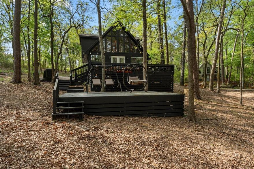 Lakeside Serenity at Lake Cypress Springs! Discover your personal haven on Lake Cypress Springs, where this gated three-bedroom, two-bathroom FULLY FURNISHED retreat awaits with 1266 square feet of thoughtfully designed living space. Whether you see a tranquil getaway or a promising investment opportunity, this charming property delivers on all fronts and comes fully finished! Perched along the shimmering waters of Lake Cypress Springs, this residence offers captivating views that transform with the seasons. The open deck provides an idyllic setting for morning coffee or evening gatherings-the perfect spot to view all the water activities happening on the lake! Natural light cascades through generous windows, illuminating the interior while perfectly framing the scenic beauty beyond. The practical layout features three comfortable bedrooms, including a serene primary bedroom retreat for peaceful slumber after days spent on the water. Both bathrooms showcase modern fixtures and finishes , ensuring comfort for everyone. As part of a Property Owners Association, residents enjoy additional amenities and maintenance services-- leaving you free to focus on relaxation rather than repairs. Enjoy dinner and live music at The Cove, a local eatery and marina on the water just minutes away. Investors will appreciate the exceptional rental potential, whether as a steady income source or popular vacation destination. This home sits in one of the few areas of the lake that allows for short term rentals making this a great opportunity to own a lake house while capturing revenue on those weekends away. The property's most coveted features include a private boat slip at the water, a community fishing pier, and fire pit for evening gatherings. Experience the perfect blend of comfort, location, and potential in this waterfront treasure where lakeside memories await creation. TAXES: INFORMATION SOURCE COUNTY APPRAISAL DISTRICT