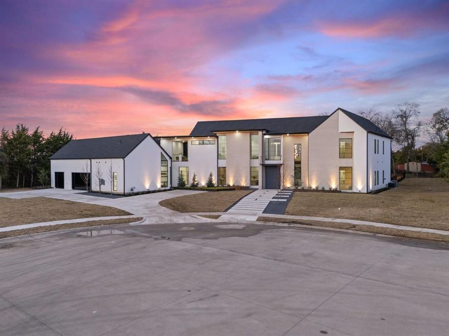 This stunning modern luxury home built by DCI Homes, located in Heath, Texas, offers over 7,000 sq. ft. of living space on a private 1 plus acre lot at the end of a cul-de-sac.  Featuring 5 spacious bedrooms and 8 beautifully designed bathrooms, this residence combines high-end finishes with exceptional craftsmanship.  The home is highlighted by sleek modern exterior finishes, a side-entry 3-car garage , and an expansive backyard with a resort-style pool, providing the perfect setting for both relaxation and entertaining.  Inside, the open-concept floor plan flows seamlessly from room to room, with soaring ceilings and and abundance of natural light.  The gourmet kitchen features luxurious Calacatta quartz countertops, custom cabinetry and top-of-the- line appliances, while the main living area showcases a striking plastered modern fireplace and white oak hardwood floors.  A custom staircase with a modern railing adds to the homes's chic design. Every bathroom is designed with premium materials, providing a spa-like experience for both family members and guests.  Every efficiency is paramount with spray foam insulation and ZIP  SYSTEM Wall Sheathing that enhances both insulation and soundproofing.  Smart home technology adds convenience and security throughout the property.  With its perfect blend of luxury, privacy, and innovation, this home is the ultimate retreat in the heart of Heath, Texas.