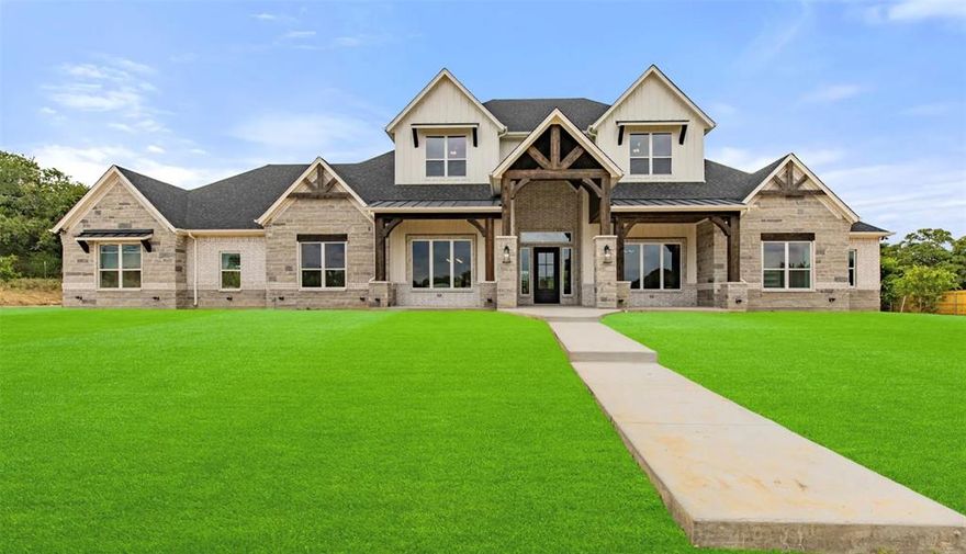 This remarkable home sits on 9 acres with 6600sf, featuring 6 bed, with their own ensuite bath, a guest bath, game room complete with a convenient kitchenette, dedicated office space with corner sliding barn doors, a specialized dog room equipped with its own bathing area, an expansive kitchen boasting 2 islands & dedicated coffee bar with a Texas shaped hammered copper sink & a nugget ice machine. 2 separate laundry rooms, providing efficiency in managing household chores. Upstairs, discover a unique living space with four built-in beds, offering a cozy retreat within the home. The primary suite is a luxurious retreat, boasting a fireplace, a warm and inviting ambiance complete with a wet bar. The en-suite bath is an exquisite sanctuary, featuring a spacious walk-in shower & oversized tub.  Additionally, the suite boasts large separate wardrobe closets. Don't forget the 2000sf barndo, offering opportunity to suit your unique preferences. Txt keyword TEXAS22 to 88000 for more details.