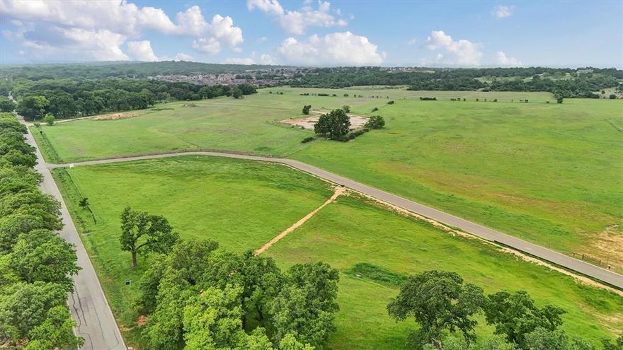 Discover Lot 12 at Waterfront on Park — a rare 1.12-acre homesite in an exclusive community on the tranquil, south-facing shores of Eagle Mountain Lake. Once a beloved city park, this private enclave now features just 16 premium lots with direct lake access for swimming, boating, and fishing, and breathtaking water views. Enjoy the serenity of lakeside living just minutes from vibrant downtown Fort Worth. This is your opportunity to create a custom retreat in a setting where nature, privacy, and convenience converge.