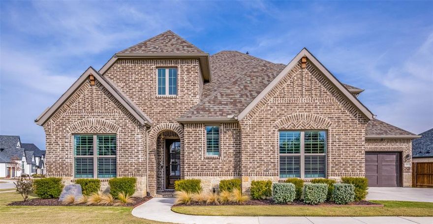 Check out this beautiful custom Drees Home on a corner-lot with NO PID or NO MUD fees. Zoned to top-rated Argyle ISD with Argyle South Elementary and Argyle HS located inside the neighborhood, as well as Liberty Christian private school within 5 miles. This 4-bed, 4-bath home offers an exceptional floorplan with soaring ceilings, updated wood-beam, designer lighting, and hardwood-style floors. The spacious living room filled with natural light boasts a stone fireplace and custom mantle and flows into a chef’s kitchen featuring a large island, stainless appliances, double oven, abundant cabinetry, and walk-in pantry. The primary suite offers a newly remodeled spa-style shower and dual vanities leading into a large master closet with the large laundry space conveniently located to bedrooms. Upstairs, enjoy a generous game room and private guest suite with plenty of flex space for entertainment, workout room, or more. Additional highlights include epoxy-coated 2-car garage plus additional separate 1-car garage, plus a covered patio overlooking a meticulously landscaped large yard. Enjoy HOA community events and social clubs, included internet and tv, front yard maintenance, along with amenities including resort-style pool, fitness center, clubhouse, nature and paved walking trails, dog park, catch-and-release fishing pond, water features, and extensive preserved open space (200 acres) weaving through the community—all with quick access to FM 1171, US 377 & major highways for easy commutes to DFW airports, schools, dining & entertainment.