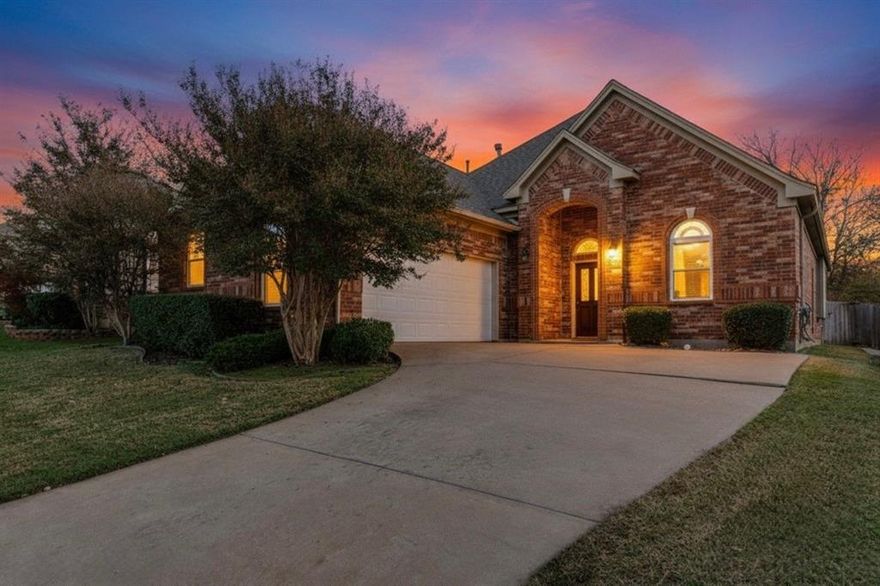 This beautifully maintained garden home welcomes you with a vibrant front lawn and beautiful curb appeal. Zoned for highly regarded Keller ISD! You will immediately notice how meticulously this home has been cared for. Nestled in a quiet, established neighborhood, this home is truly move-in ready. Inside, a flexible front room can serve as a formal dining space, home office, or cozy library. The centrally located living area is bright and open, providing seamless flow to the kitchen and casual dining area. Fireplace is a lovely focal point. Living room provides views of the serene back yard. Many windows flood the area with natural light! The kitchen features abundant cabinetry, a large pantry, newer stainless steel appliances and opens to a cheerful casual eat-in area. Barstools could also be placed at the island countertop. A charming brick privacy wall creates a serene outdoor setting—perfect for morning coffee or relaxing in the evenings. The spacious primary suite easily accommodates larger furnishings and includes room for a sitting area. Its ensuite bath features a walk-in shower with modern frameless glass enclosure, garden tub, separate vanities, and generous walk-in closet. Two additional bedrooms and a secondary bathroom are conveniently situated down the hall. The laundry room off the kitchen has room for extra storage of cleaning supplies, groceries and has extra cabinetry. The 2 car garage with large driveway provides ample room for extra parking if needed. This home is ideal for anyone seeking a property that has been lovingly and meticulously maintained. A very short walk to the community pool and club house. This neighborhood has a park and is close to walking trails. HVAC system 3 years. Flooring and windows replaced 1.5 years ago. Water heater 5 years ago. Recently updated appliances. Carpet and primary bath flooring 6 months old.