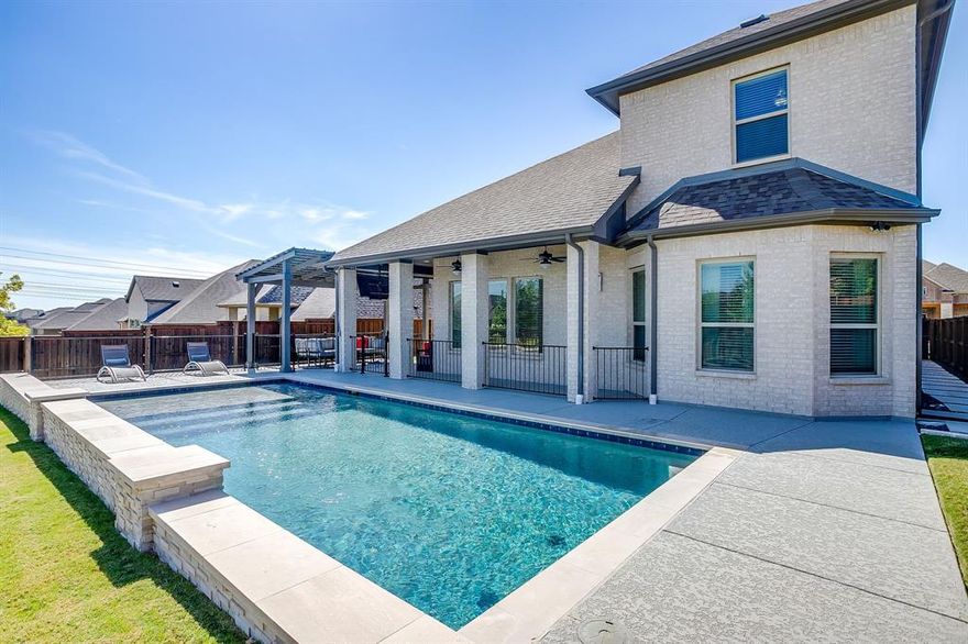 Welcome to 5637 Pope Creek — a truly move-in ready, luxury home offering comfort, style, and unbeatable convenience! From the moment you enter, the soaring ceilings, beautiful staircase, and open floor plan create an immediate wow factor. This thoughtfully designed home features two bedrooms and two full baths on the main level, ideal for multi-generational living, guests, or a private suite setup. A dedicated home office makes remote work effortless.
You’ll love the extensive UPGRADES throughout — including upgraded cabinets, carpet, tile, countertops, solid wood doors, and oversized baseboards. The chef’s kitchen shines with abundant cabinetry, quartz countertops, a gas cooktop, and lighted display cabinets, perfect for cooking and entertaining. The bright living room features a floor-to-ceiling tiled fireplace, gas logs, and stylish flooring.
Spacious primary suite offers a true retreat with a spa-like bath, oversized soaking tub and walk-in shower, dual sinks, and a large walk-in closet.
Step outside to your backyard oasis, ideal for relaxing or hosting. Enjoy the heated pool, water feature, sundeck, expanded patio, pergola, and mounted TV — and the patio furniture stays!
Located in the highly desirable Ventana community, you’ll have access to two resort-style pools, a playground, walking trails, and regular neighborhood events. All just minutes from Clearfork, TCU, downtown Fort Worth, shopping, dining, and more. The home sits on a quiet double cul-de-sac with no through traffic.
This home truly has it all — come take a look today!