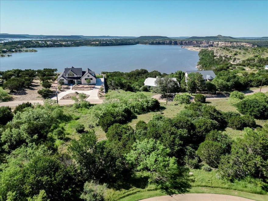 Bay Hill Drive, Bay Hill Drive, Bay Hill Drive! The best view on Possum Kingdom Lake.  This stunning homesite backs up to Hole 6 of the Cliffs Championship Golf Course, giving you scenic golf course views, and lake-life luxury.  Whether you're seeking peaceful weekends or fun filled family memories, this is where your PK Lake journey begins. Located in The Cliffs Resort, you'll enjoy amenities like: golf, boating and water activities, fine dining and more. HURRY - life at Possum Kingdom Lake is calling.