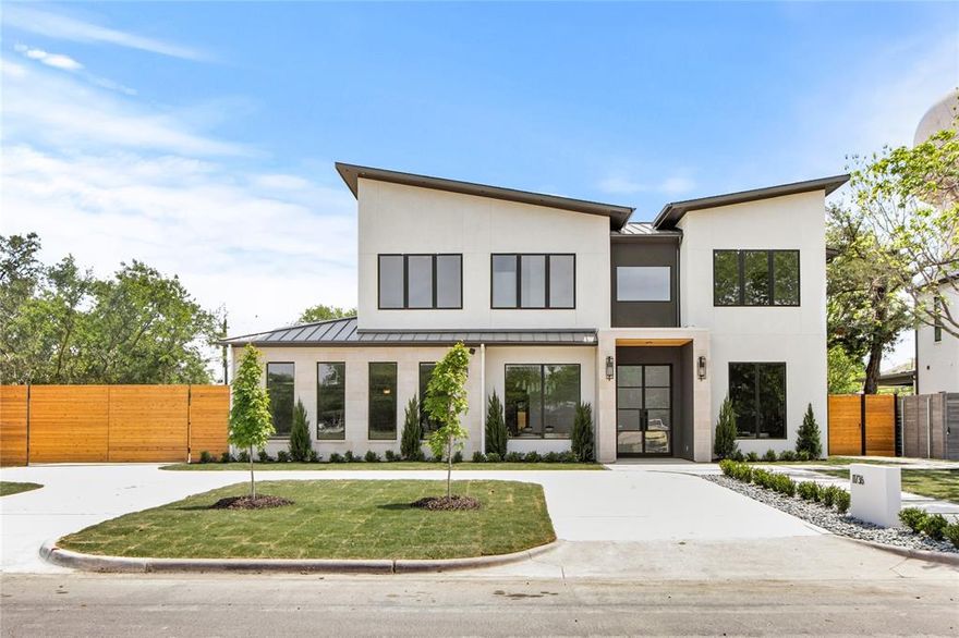 Welcome to 11736 Jamestown Rd, an exceptional new construction in North Dallas offering 5 bedrooms, 5.3 bathrooms, and 5,607 sqft of refined living on a 0.37-acre lot. Thoughtfully designed with a seamless blend of transitional architecture and modern luxury, this custom two-story home features striking curb appeal, a steel and glass front door, and a professionally landscaped yard with synthetic turf, a heated pool and spa, outdoor kitchen, and putting green.

Inside, you're welcomed by wide-plank white oak hardwood floors, 8-foot doors and windows, and high-end finishes throughout. The chef’s kitchen is equipped with a full Wolf, Sub-Zero, and Cove appliance package, Taj Mahal leathered quartzite counters, a large island, and a spacious butler’s pantry with additional refrigeration and a second dishwasher. The living area includes a custom natural stone fireplace, 15-foot sliding glass doors, and beautifully stained white oak ceiling beams. A glass-enclosed wine cellar with a dedicated cooling unit adds a dramatic design element.

The smart home automation system, powered by Control4, controls lighting, thermostats, security, garage doors, pool functions, and more. Every bedroom offers a private bath with curated designer tile, lighting, and plumbing fixtures. The primary suite includes a gas fireplace, spa-like bath with soaking tub, frameless shower, and custom walk-in closet. Additional highlights include a private gym, upstairs laundry, spray foam insulation, 18 SEER HVAC units, and Marvin STC sound-rated windows.

This home combines luxury, efficiency, and style in one of Dallas’s most desirable neighborhoods. A rare opportunity to own a custom build with timeless elegance and today’s most sought-after features. Schedule your private tour today.