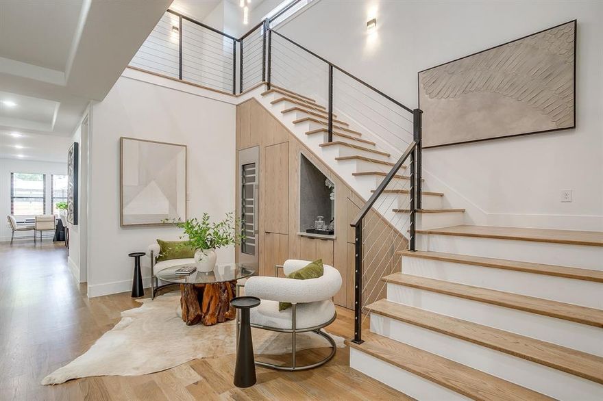 Motivated seller bring an offer, interest rate and closing cost incentives available. Brand new move-in ready luxury home in the heart of Fort Worth’s Cultural District! This beautifully designed new build features 4 bedrooms, 5 bathrooms, a dedicated office with French doors, and multiple living areas.
The open-concept kitchen is a chef’s dream with light wood cabinetry, quartz countertops, a bold black vent hood, built-in fridge, commercial gas range, and a walk-in pantry with custom built-ins — all overlooking the dining and living areas. The living room features ceiling beams, built-ins, a 60” gas fireplace, and sliding doors that open to a covered patio with an outdoor kitchen and low-maintenance turf yard. The main-level primary suite includes a walk-through shower, soaking tub, dual vanities, and a custom walk-in closet. Upstairs offers a media room, game room with wet bar, and three additional bedrooms — one Jack-and-Jill, and one with its own private bath.  Additional features include a flex space with wine fridge, pet spa, mudroom, spacious utility room, and built-in sound system wiring. Comes with 10 year structural, 2 year plumbing Hvac & electrical, and 1 year cosmetic warranty!