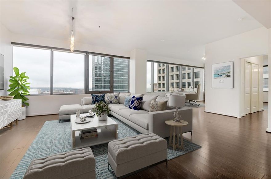 This highly coveted NW corner floor plan with a private balcony is perched on the 18th floor and has been very well maintained by the long time owner.  It offers a perfect blend of style and functionality, which makes this move-in ready home a must see!!!  Freshly painted throughout in 2026.  Newer kitchen appliances and water heater.  Enjoy the spectacular views of Downtown Dallas from all rooms and from your private terrace.  Upgrades include engineered wood floors throughout (no carpet), solar shades, newer kitchen appliances with GAS cooking, AT&T fiber optic internet wiring.  Two assigned parking spaces (tandem 235 A&B) along with storage room #1015-S (approx. 25sf) will convey with sale.  The Metropolitan is an amenity rich building that includes 24-7 Concierge, hobby-craft room, recently renovated theater on mezzanine level, conference room, community room, gym, grill area, recently renovated pool-spa & beautifully landscaped outdoor living areas located on the sixth floor.  Walk to the AT&T Discovery District, Dallas Arts District, the flagship Neiman Marcus and multiple entertainment & restaurant venues.  Attention dog lovers:  The Metropolitan is located next to Civic Garden Park where a new dog park is being built and is scheduled to open by Fall of 2026.  The DART train to both airports and the greater Dallas area is located just two blocks away.  The Metropolitan offers urban living at its finest in the heart of Downtown Dallas.  This sophisticated home is ready for you to move-in and enjoy right now!!!