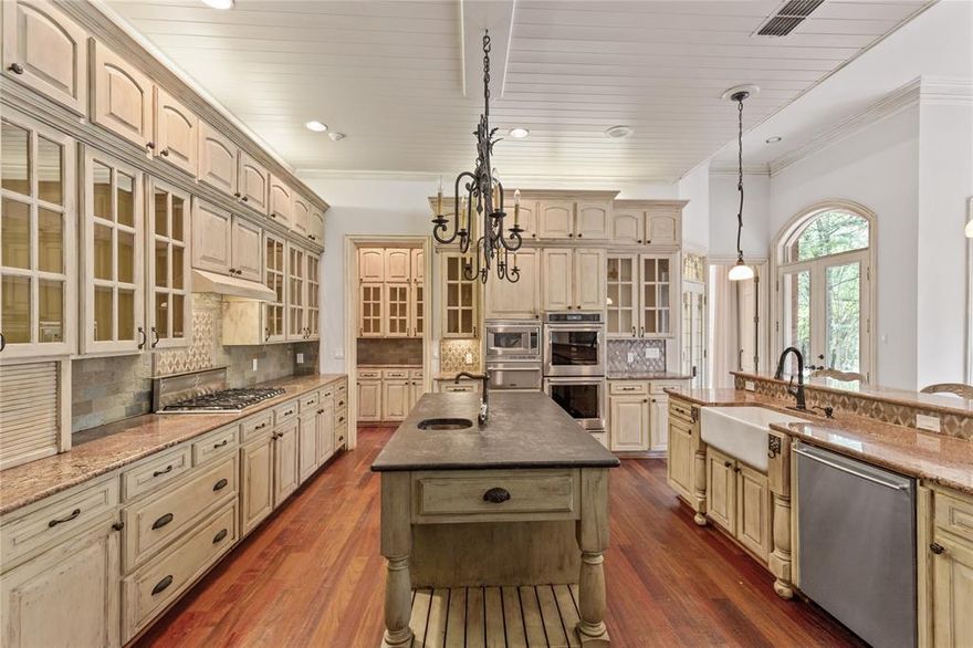 Don’t miss this classic, one owner custom estate situated on a luscious 1.84 acre, cul-de-sac lot in Colleyville, TX. This incredible home will take you back to era when quality and craftsmanship were job One. Offering a beautiful primary suite and updated resort bath, Gourmet Chefs Kitchen, cozy library and massive floor to ceiling windows overlooking the stunning back yard. Improved with 8001 SF of living area, there is room for your every desire! Designed with 4 bedrooms, 5.5 baths and setup perfectly for the home based professional with private entry, separate office, boardroom and even its own kitchenette. With unparalleled privacy and a true one of a kind back yard oasis that features its own fountain and brook flowing to the pebbletech finished pool, expansive wood decks, boardwalks and amazing views of the adjacent private pond. With aggressive pricing, this incredible estate offers unlimited potential as well as a great investment!