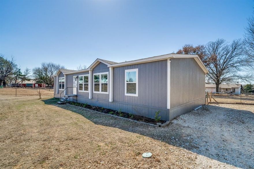 Discover the perfect blend of modern comfort and Texas country charm with this beautiful 3-bedroom, 2-bathroom manufactured home built in 2021, nestled on 2.38 acres in Cleburne. Offering peaceful rural living just minutes from town, this property provides the space you crave without sacrificing convenience.

The home sits on its own private 1-acre tract, giving you room to relax and enjoy wide-open Texas skies. Inside, you’ll find a thoughtfully designed layout featuring modern updates, stylish finishes, and an inviting open-concept living area perfect for gathering with family and friends. A flex room sitting right in the middle of the home offers the opportunity for a playroom or movie room to be enjoyed by the entire family. The spacious kitchen flows seamlessly into the dining and living spaces, while the primary suite offers a comfortable retreat with a private bath and generous closet space. Two additional bedrooms and a second full bath provide flexibility for guests, a home office, or hobbies.

In addition to the home’s 1 acre, the sale includes a separate 1.38-acre parcel—an incredible bonus opportunity. This additional tract features a shop with water and electric available, making it ideal for projects, storage, a business venture, or future expansion.

Whether you’re looking for room to spread out, space to work and play, or simply a peaceful place to call home close to all the amenities of town, this property delivers the best of both worlds. Don’t miss your chance to own a slice of Texas countryside with modern comforts already in place.