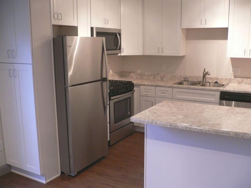 Updated throughout including stainless steel appliances, bathrooms, flooring, plumbing, lighting, ceiling fans, cabinetry, countertops, and more. Recessed can lighting in the living areas. 14 SEER HVAC system. Lots of storage with walk-in closets in both bedrooms. This home includes a kitchen refrigerator and a stack washer & dryer unit. Community pool and laundry facility within the complex. A prime corner unit in this quiet GATED community with quick access to I-35.