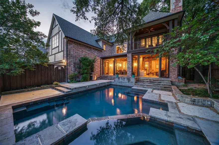 Nestled beneath mature trees on a premier street in HPISD, this elegant pier and beam home blends timeless architecture with a unique, functional layout ideal for modern living. The main level features a private guest suite and richly paneled office with French doors opening to a serene patio. A chef’s kitchen with Sub-Zero, Wolf, dual dishwashers, pot filler, and a walk-in butler’s pantry opens to a spacious family room with wet bar and screened-in patio overlooking a saltwater pool. Upstairs: renovated primary suite with spa bath, custom closet, and private patio, plus 3 ensuite bedrooms, game room, media room with wet bar, and laundry. Additional highlights include three covered patios, an oversized 2-car garage with epoxy floors, and a gated driveway. Advanced security system with six cameras, solid 8-foot interior doors, tall ceilings, and premium finishes throughout. Recent upgrades include Class 4 impact-resistant roof, dual water heaters, refreshed fence, and retaining wall. Ideally located near HPISD schools, NorthPark, Preston Center, and SMU.