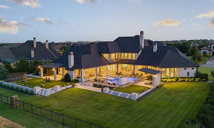 A one-of-a-kind opportunity and setting on the coveted TPC Craig Ranch golf course, hosting the Byron Nelson in your back yard! This stunning custom construction allows the buyer 70K INITIATION CLUB FEES WAIVED, BYPASSING THE WAIT LIST FOR MEMBERSHIP. Offering the best in luxury + comfort available today, w open concept indoor,outdoor living designed for year round entertaining. Full home generator, extra lg 5 car gated garages, class 4 roof, 1rst fl game-media-bar space, 15’ glass-800 bottle wine room, 30’ primary suite w 21x13 closet, 1rst fl in-law suite, 2 laundry rms + elevator ready. Newly designed backyard extraordinaire w salt pool+chiller,spa,kitchen,cantilevered cabana,covered verandas,17' fire wall,putting green,in-ground trampoline + extensive TV, sound systems thru out. 4 FPs, expansive open living spaces w stunning kitchen anchoring the heart of the home + catering space. Unfinished bonus space can make great apt, ADU. 1rst time offered for this premier golf lot setting.