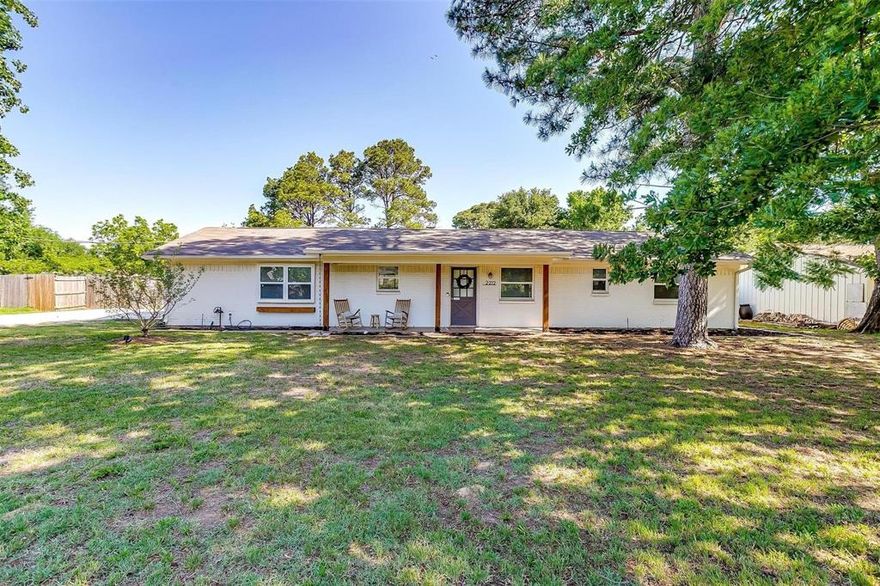 Introducing a charming retreat just moments from Grapevine Lake, where scenic trails and lakeside living are right outside your door. This inviting 3 bedroom, 2 bath home offers a perfect blend of comfort and character, with standout curb appeal enhanced by refreshed front landscaping, including new mulch and seasonal flowers that create a warm welcome from the moment you arrive. Inside, you will find a light and airy feel with fresh paint in most rooms, complementing the home’s cozy yet spacious layout. The living area is anchored by a stunning stone fireplace, creating a warm focal point ideal for gathering. An additional flex space adds versatility, perfect for a home office, gym, playroom, or creative studio. Step outside to discover one of the home’s true highlights, an expansive backyard designed for both relaxation and entertaining. The covered patio completed in 2023 offers the perfect setting for year round enjoyment, from quiet mornings to lively evenings with friends and family. Ideally located just minutes from the charm of Grapevine Historic Main Street District and the premier shopping and dining of Southlake Town Square, this home delivers both convenience and a vibrant lifestyle. A rare opportunity to enjoy space, charm, and location all in one. Welcome home. List and dates of updates available upon request.