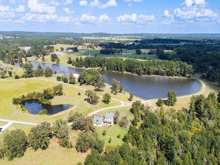 Experience refined lake living in this 4-bedroom, 4-bath Craftsman Mission–style home set on nearly two acres within the gated community of Caddo Creek Estates. Thoughtfully designed for comfort and ease, the home offers tranquil water views from nearly every window and porch, creating a seamless connection to its natural surroundings.

The main-level suite opens to a private deck overlooking the lake, while the upstairs primary suite features its own balcony with peaceful pond views. Generous living spaces, abundant natural light, and flexible room configurations make the home equally suited for full-time living, weekend escapes, or a well-considered downsize without compromise. A detached four-car double-tandem garage with new epoxy flooring provides exceptional space for vehicles, watercraft, hobbies, or workshop use. The setting is quiet, private, and intentionally designed for low-maintenance enjoyment.

Residents of Caddo Creek Estates enjoy a rare lifestyle centered around six wake-free lakes, ideal for kayaking, paddleboarding, fishing, or simply enjoying the view. Community amenities include a 6,000-square-foot clubhouse, swimming pool, playground, and guest lodging available for residents’ visitors—offering the feel of a private resort without leaving home.

Conveniently located just 10 minutes from Frankston, 30 minutes from Tyler, even closer proximity to both Athens and Canton, and approximately 90 minutes from Dallas, this property delivers the perfect balance of privacy, recreation, and accessibility.

Furnishings and other non-realty items available to convey.