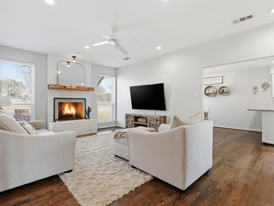 Sought after Lake Highlands location in a quiet pocket of Highland Meadows, this charming two story home offers fresh updates and timeless appeal on a dead end corner lot. Raised ceilings and hardwood floors throughout most of the home create an open, welcoming feel upon entry. The living area features an updated wet bar that flows seamlessly into the fully remodeled kitchen with granite countertops, center island, abundant cabinetry, pantry, stainless steel appliances approximately three years old, and classic subway tile backsplash. A convenient mudroom and utility area sit just off the kitchen. Recent improvements include a new roof installed in August 2024, replacement windows and fencing less than five years old, and new flooring on the second floor and in the primary bathroom. HVAC updates include one system replaced in 2019, with the second system remaining original. The updated primary bedroom features a walk in closet. Situated on a creek lot with easy access to Walnut Hill Lane, Northwest Highway, and minutes from I 635. Zoned to Richardson ISD and located near McCree Park, this home offers a combination of location, privacy, and functionality.