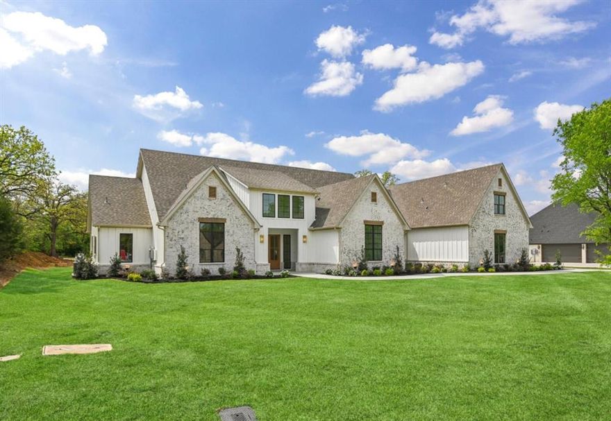 Situated behind the gates of Taylor Bridge North, this exceptional new construction home sits on 1.10 private acres within the highly acclaimed Centennial ISD. A sweeping concrete drive and oversized three-car garage create a striking first impression. Inside, soaring ceilings and expansive windows fill the home with natural light, highlighting refined finishes and thoughtful design throughout. The chef's kitchen features state-of-the-art appliances, quartz surfaces, custom cabinetry, and a seamless flow for entertaining. Two private primary suites — each with its own spa-inspired bath — offer unmatched flexibility, whether for multi-generational living, an in-law suite, or simply the ultimate guest experience. Towering mature trees frame the property, providing shade, privacy, and a serene Texas backdrop. A rare opportunity to own a refined estate that blends luxury, space, and top-tier schools with convenient access to nearby amenities.