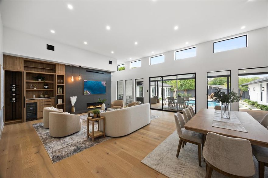 Introducing 4624 Willow Lane—a rare single-story estate that redefines intentional luxury living in the heart of Dallas. Designed with a focus on architectural warmth and resort-centered flow, this fully reimagined residence offers a level of lifestyle, privacy, and functionality that is rarely achieved—and even more rarely available. Spanning nearly 5,000 square feet, the home is anchored by a striking U-shaped design that wraps seamlessly around a private resort-style pool, creating a true indoor-outdoor living experience. Expansive walls of glass invite natural light into every major living space, while over 600 square feet of covered alfresco living—complete with an outdoor kitchen—extends your ability to entertain year-round.
At the center of the home, a chef’s kitchen is thoughtfully paired with a fully equipped prep kitchen, delivering both elevated design and high-level functionality. This dual-kitchen concept allows for effortless hosting while maintaining a clean, refined presentation in the main living areas.
The floorplan reflects a deep understanding of how today’s luxury buyer lives. Four spacious bedrooms, each with ensuite baths, are complemented by a dedicated media room, private study, and flexible spaces designed to adapt to evolving needs. The entire east wing is reserved for the primary suite—creating a private retreat complete with a spa-inspired bath, oversized closet, and tranquil views of the pool.
Every detail—from the curated material selections to the integrated indoor-outdoor connection—has been designed with purpose. A full laundry center with dog wash station, circular drive, and gated access further enhance the home’s everyday functionality.
Set on a beautifully landscaped .39-acre lot in Forestcrest Estates, the property offers convenient access to Dallas’ top private schools, premier dining, and luxury shopping.