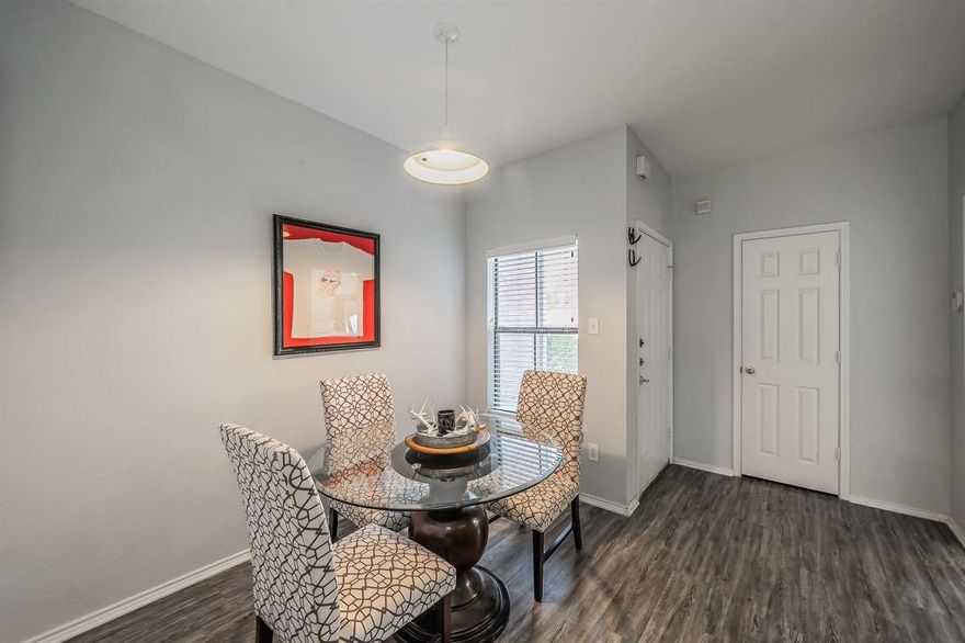 Beautifully updated 2-bedroom, 2-bath condo in a highly sought-after community, perfectly positioned on the first floor with serene pool views. This move-in ready home features neutral paint tones and luxury vinyl plank flooring throughout. The inviting living room includes a cozy wood-burning fireplace and opens to a private balcony overlooking the pool—ideal for morning coffee or unwinding in the evenings.

The kitchen is designed for both style and function with white cabinetry, stainless steel appliances, quartz countertops, and a breakfast bar that flows into the dining area. The spacious primary suite offers a bay window, large walk-in closet, and an en-suite bath with quartz countertops and updated 24x12 marble-style tile in the shower-tub combo. A split-bedroom layout provides privacy, with a generous second bedroom, its own walk-in closet, and a dedicated full bath with quartz countertops.

Additional highlights include full-size washer and dryer, first-floor access, and rare dedicated covered parking.

The community offers multiple pools, built-in BBQ areas, and a club room—perfect for a low-maintenance, lock-and-leave lifestyle. Ideally located in the Fort Worth entertainment district near Central Market, high-end shopping, restaurants, the hospital district, TCU, downtown, UNT Health Science Center, and the Cultural District. Quick access to Hwy 30 and University Drive makes commuting a breeze.

A rare opportunity to own a first-floor, two-bedroom condo with covered parking in one of the most convenient and desirable areas of Fort Worth.