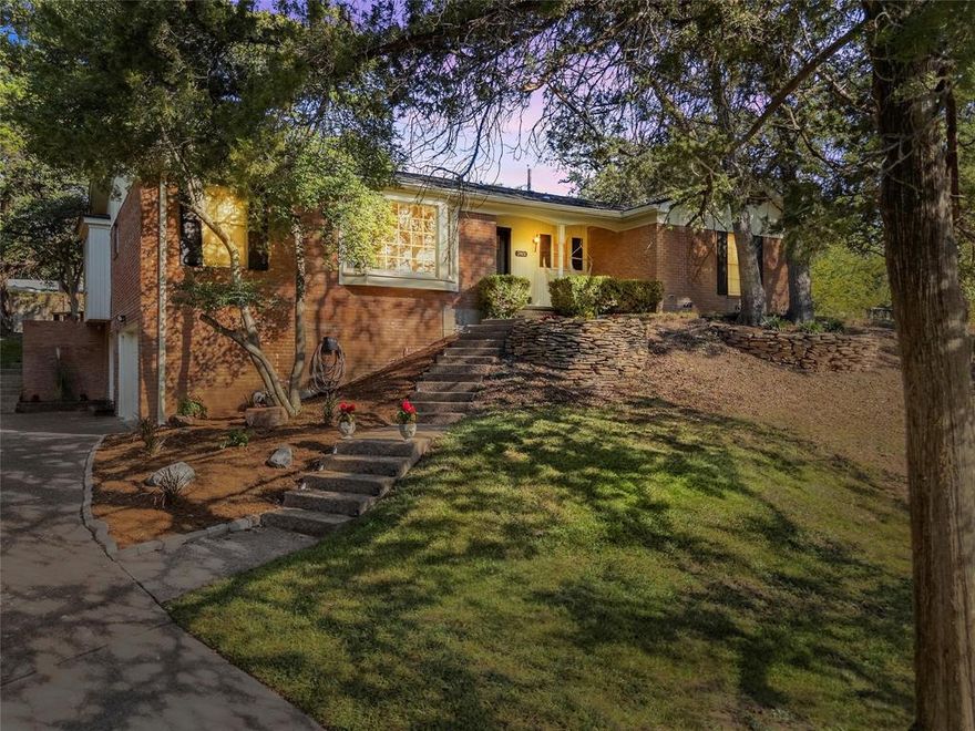 Are you looking for every day living that feels like a retreat? Welcome to 2801 N 42nd Street, a stunning 4 bed, 3 bath home that combines classic charm with modern updates in the highly desirable Mountainview neighborhood. Thoughtfully renovated, this home offers timeless elegance, functional spaces, and a serene, retreat-like backyard. A gracious entry welcomes you into sun-filled spaces adorned with intricate trim work, built-in cabinetry, beautiful finishes and exquisite chandelier light fixtures that set a tone of quiet sophistication. The formal dining room, highlighted by a picturesque bay window, is an ideal setting for meaningful connection. At the heart of the home lies a newly renovated kitchen designed to delight any cook. Featuring an open-concept layout, gas range, large island, coffee bar and abundant storage, it seamlessly connects to the living space. A charming reading nook and fireplace create cozy moments throughout the year. You’ll find three newly renovated bedrooms and a downstairs exercise room, that could be a fourth bedroom and full bath. All full bathrooms have been beautifully updated. The home features all-new flooring, updated plumbing, and electrical systems for peace of mind. Step outside to discover a backyard designed for relaxation. A new deck overlooks a private retreat complete with mature trees, firepit area, and ample space for outdoor living. Whether hosting friends or enjoying quiet evenings, this backyard is an inviting extension of the home’s living spaces. Additional features include a renovated laundry room and a two-car garage. Located just minutes from grocery stores, Target, and local amenities, this home perfectly balances comfort, style, and convenience. This thoughtfully updated, move-in-ready residence with a blend of elegance, functionality, and lifestyle appeal won’t last long. With its charming interior and serene backyard, this property truly has it all in one of Waco’s most desirable neighborhoods.