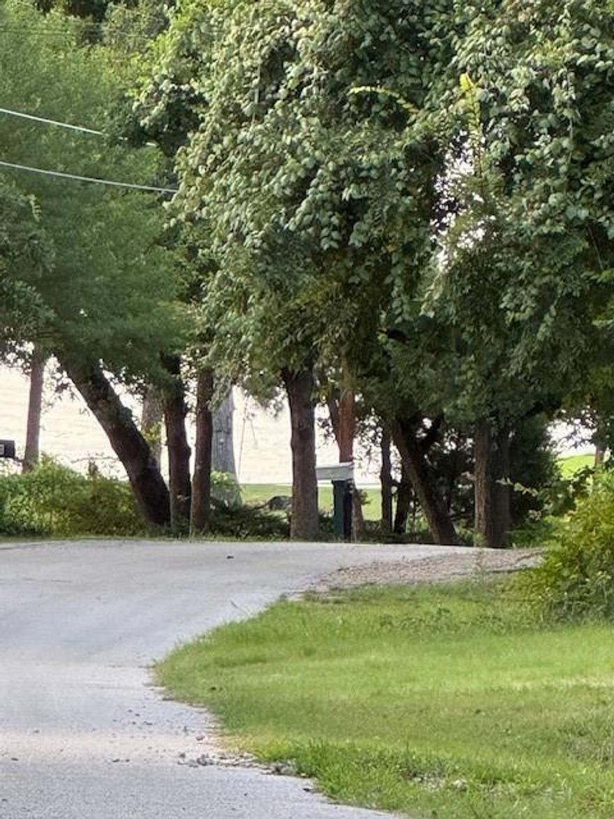 Westwood Beach property offering nearly an acre of land across four spacious lots—an ideal setting for lake living or future expansion. This unique listing includes a versatile shop building complete with a bathroom, kitchenette, and a dedicated hobby room, perfect for projects, storage, or guest use. Enjoy easy access to Cedar Creek Lake with the community boat ramp just a short walk away, making it simple to launch your boat or enjoy a day on the water. This lake community property provides the perfect blend of space, convenience, and lakeside lifestyle.