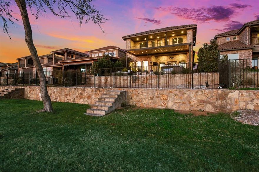 Welcome to this stunning custom-built home located in the only 24-7 gated and guarded golf course community on the lake! This immaculate home features 4 bedrooms, 4 full bathrooms, a designated office, bonus room with add. flex space, and the most amazing view of Eagle Mountain Lake! Enjoy the expansive open living, kitchen and dining area adorned with beautiful wood beams and a floor to ceiling stone fireplace, seamlessly connecting to the outdoors making it the ultimate indoor & outdoor living experience. Enjoy waterfront views from every angle! The kitchen is complete with an induction cooktop, oversized island, pot filler, beverage cooler and a walk in pantry. The master suite is on the first floor and offers serene lake views and direct access to the laundry room through the thoughtfully designed closet. Upstairs discover two additional bedrooms, a bonus room, and office leading to the oversized balcony overlooking the lake with access from the office and bonus room. Outside, entertain in style with two seating areas, outdoor kitchen with a built in grill, and fire pit making it perfect for entertaining. The patio also features a louvered roof pergola. Custom shades throughout the entire home with the main living area and master being electronic. Whole home water filtration and softener system, as well as a Reverse Osmosis water system in the kitchen! The neighborhood cannot be beat! 18-hole golf course, clubhouse with restaurant and bar, two pools, fitness center, basketball and pickle ball court, beachfront area, boat ramp, docks and the list goes on! Don't miss this chance to make this unique property yours!
