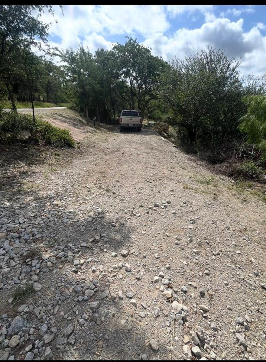 Let this become your weekend retreat. There is a RV pad ready to accommodate you. The lot has brand new aerobic septic never used. 50-amp RV plug installed, and water meter installed and ready for your RV. A walkway will lead you down to the water for fishing, boating or just setting by the campfire after a nice cool swim.