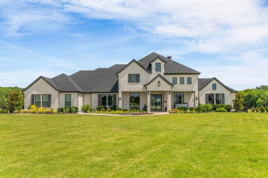 Stunning Owens Warford Custom Home with 5 bedrooms and 4.5 baths on 2 acres in a quiet cul-de-sac within a gated community in highly acclaimed Lovejoy ISD. This thoughtfully designed home features a dedicated office, spacious living areas, split secondary bedrooms, with wood flooring and custom touches throughout. The gourmet kitchen boasts high-end appliances, including a 6-burner cooktop with griddle, double ovens, wine fridge, and a walk-in pantry equipped with a second refrigerator, microwave, dishwasher, and ice maker. Additional upgrades include an Aquasana whole home water purification system, a safe room and a dog washing station.

Enjoy resort-style outdoor living with a large covered patio featuring a fireplace, built-in grill, and Green Egg, offering plenty of space for entertaining. The backyard oasis is complete with a sparkling pool, professional putting green, private pond and fire pit. A rare opportunity to own a luxury custom home in one of Lucas’s most desirable gated communities.