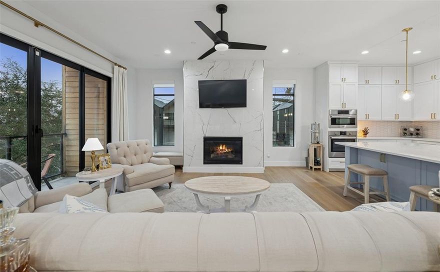 One of the most desirable floor plans in the neighborhood, this corner residence stands out for its spacious room sizes, abundant natural light, and exceptional outdoor living. Expansive windows brighten the home, while a custom pergola creates an inviting extension of the living space outdoors.
The second level features an open-concept design ideal for both everyday living and entertaining, complete with a fireplace, a dedicated dining area with built-ins, and a well-appointed kitchen. The primary suite offers a generous layout and a private ensuite bath. On the third floor, a secondary bedroom, built-in hallway shelving, and a full laundry room provide comfort and convenience. A first-floor bedroom, currently serving as a home office, offers excellent flexibility to suit a variety of needs. The turfed backyard provides a low-maintenance setting perfect for relaxing or hosting guests. Ideally located with easy access to major freeways, SMU, Baylor, Uptown, and the popular restaurants and shops along Greenville Avenue, this home combines style, function, and an exceptional Dallas location.