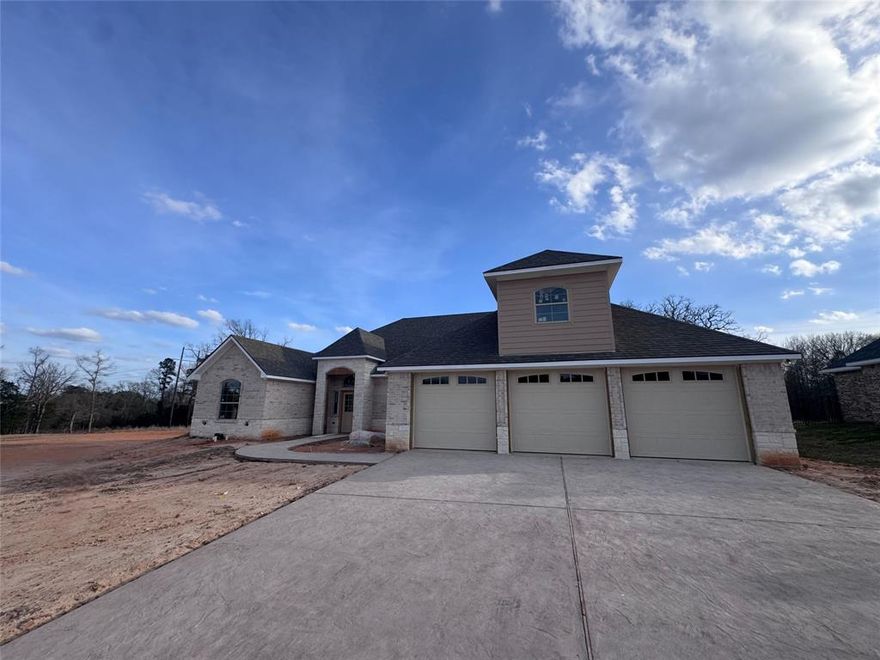 Welcome to this stunning new construction home located in the desirable Corrigan Trails community in Lindale, Texas. Offering 4 bedrooms, 4 bathrooms, and approximately 3,327 square feet of thoughtfully designed living space, this contemporary one-story home blends comfort, style, and functionality. The exterior showcases an attractive brick and stone façade that sets the tone for the quality found throughout the home. Inside, the spacious layout features a split master bedroom design, creating privacy and a relaxing retreat. A formal dining area and bright breakfast room provide multiple spaces for gathering and entertaining. The modern kitchen is equipped with gas cooking, a pantry, and generous workspace, making it perfect for everyday living or hosting guests.