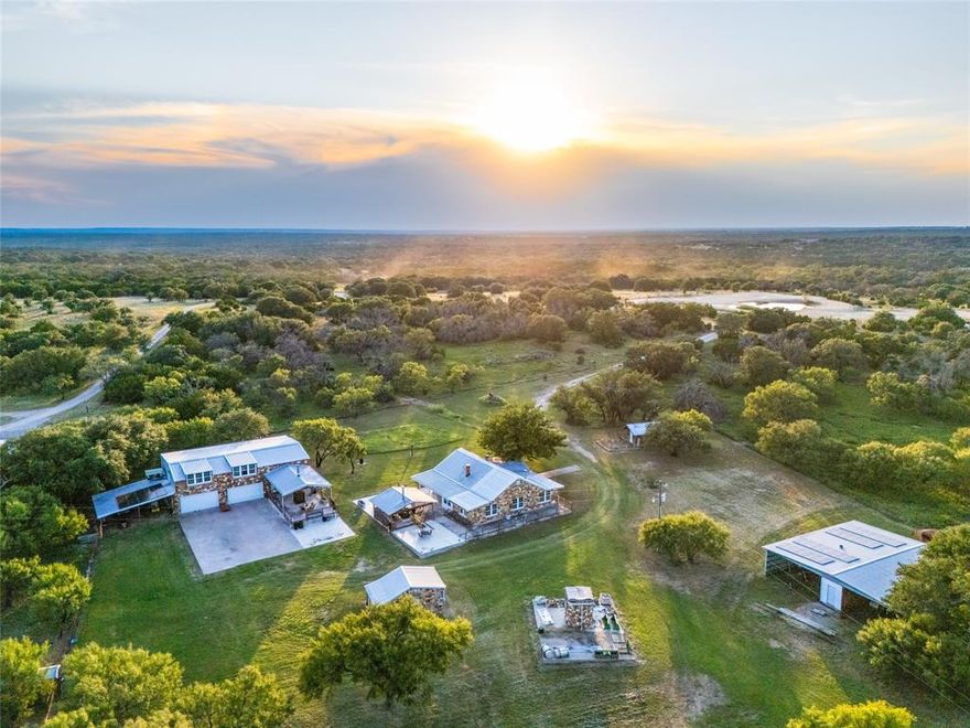 Welcome to Peak View Ranch, an 88 acre property located in beautiful Mills County, Texas! This ranch combines modern comfort, historic charm, and endless potential, all in a quiet and peaceful setting! The main home offers 2 bedrooms, 3 full baths, and a large office, along with an open living area and gourmet kitchen featuring Frigidaire Professional Series appliances, custom cabinetry, and ample counter space. Upstairs, a spacious game and family room provides the perfect place to relax or entertain, while the master suite includes his-and-hers walk-in closets and a beautiful view of the ranch through the big windows. Solar panels help keep electric costs to a minimum. A covered front porch area with a fireplace creates a cozy outdoor hangout area, perfect for grilling out and enjoying the famous Central Texas sunsets! The original 1940 farmhouse has been fully remodeled into a charming 2-bedroom, 1-bath guest house, complete with a large smoker on its own porch—ideal for gatherings with family and friends or income potential as an Airbnb. The property is well-equipped for agricultural use with cattle pens, perimeter fencing, and two water wells. There is plenty of space to store equipment with a barn and other storage areas. The property also has an abundant population of wildlife, and has a track record of being a great deer hunting ranch. With over 5,000 feet of road frontage, there is a unique opportunity to subdivide this ranch into smaller lots. Peak View Ranch also gives you the opportunity to establish your own vineyard, especially given the location being next to one of the largest vineyards in Texas. Breathtaking views of San Saba Peak, large neighboring properties, and a peaceful, private atmosphere make this an exceptional opportunity for ranching, recreation, or investment. Seller financing available. The ranch is conveniently located just 10 minutes from Goldthwaite, and 1 hour and 30 minutes from Austin